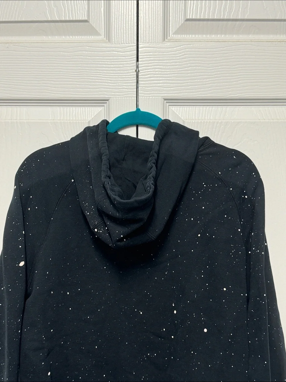 Nike Black Pullover Hoodie with White Swoosh and Paint Speckle